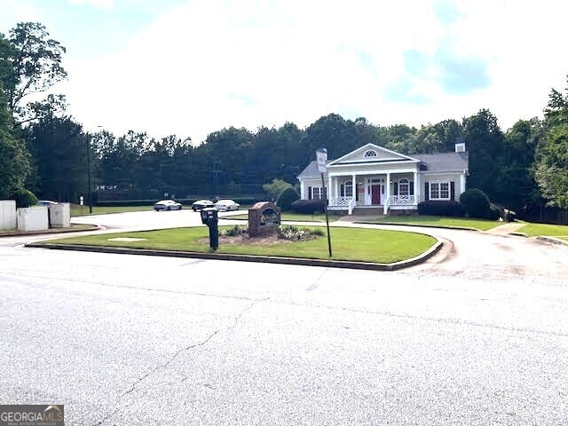 149 Titan Rd, Stockbridge, GA 30281 - view of asphalt road with curbs
