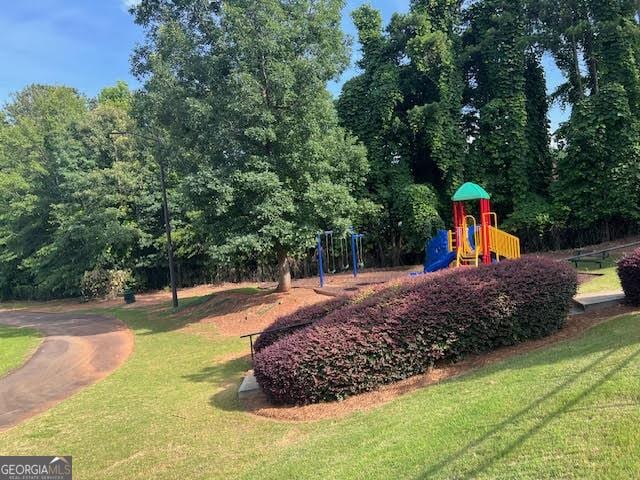 149 Titan Rd, Stockbridge, GA 30281 - community playground featuring a lawn