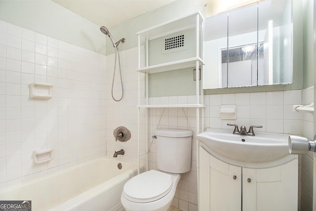 2965 Pharr Ct NW Unit 714, Atlanta, GA 30305 - full bath with shower / bathtub combination, toilet, vanity, and tile walls