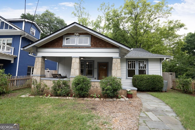 2056 Hosea L Williams Dr NE, Atlanta, GA 30317 - view of front of property with covered porch, a shingled roof, and stone siding