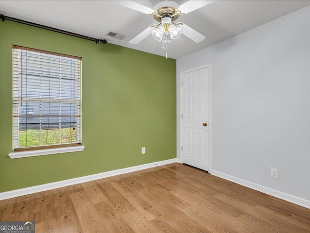 4517 Baker Grove Rd NW, Acworth, GA 30101 - spare room featuring light wood finished floors and ceiling fan
