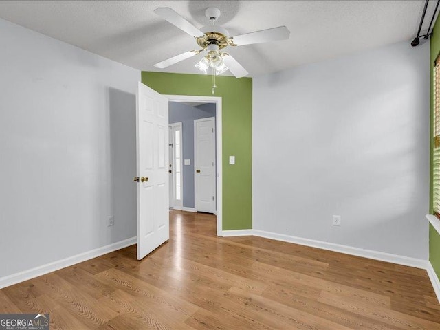 4517 Baker Grove Rd NW, Acworth, GA 30101 - spare room featuring ceiling fan and light wood-style floors