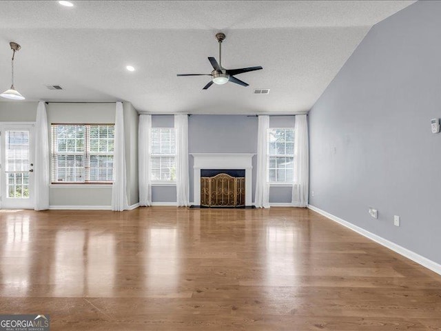 4517 Baker Grove Rd NW, Acworth, GA 30101 - unfurnished living room featuring a ceiling fan, wood finished floors, a textured ceiling, a fireplace with flush hearth, and recessed lighting