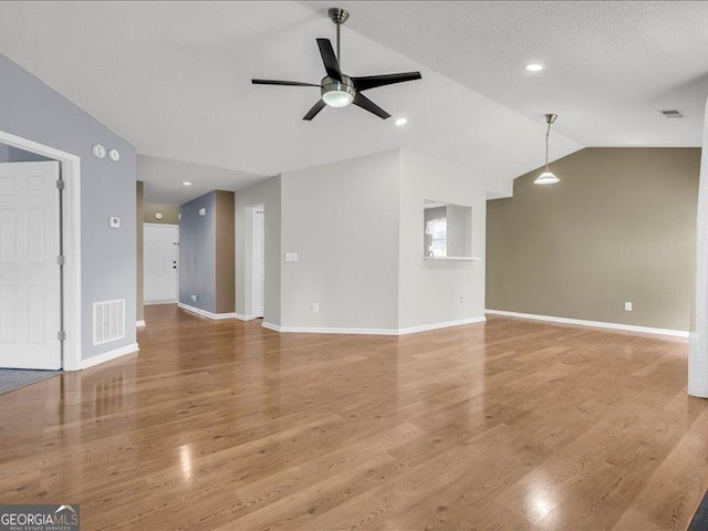 4517 Baker Grove Rd NW, Acworth, GA 30101 - unfurnished living room with ceiling fan, vaulted ceiling, and light wood-type flooring