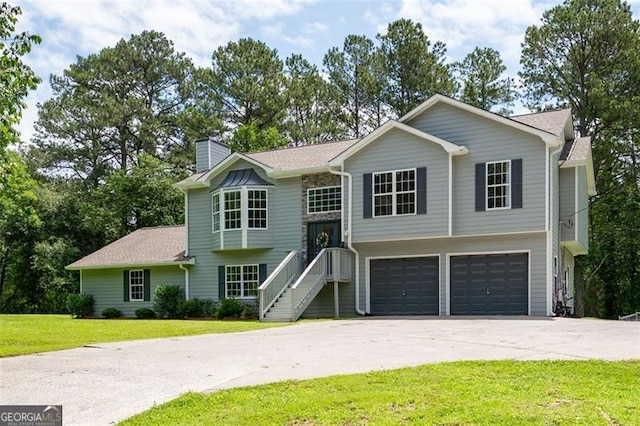 76 Vaughn NE, Cartersville, GA 30121 - raised ranch featuring an attached garage, driveway, a front yard, and a chimney