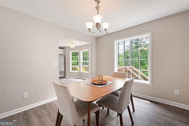 76 Vaughn NE, Cartersville, GA 30121 - dining room with a chandelier, wood finished floors, and baseboards