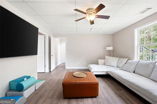 76 Vaughn NE, Cartersville, GA 30121 - living room featuring a paneled ceiling, ceiling fan, wood finished floors, and baseboards