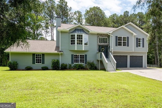 76 Vaughn NE, Cartersville, GA 30121 - bi-level home with an attached garage, a chimney, driveway, and a front yard