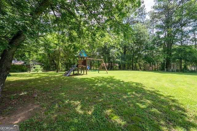 76 Vaughn NE, Cartersville, GA 30121 - view of grassy yard with a playground
