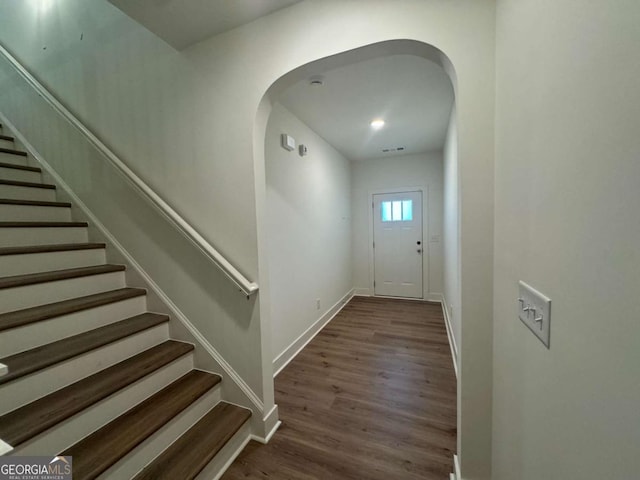 7695 Baron Rd, Fairburn, GA 30213 - entrance foyer featuring stairs, wood finished floors, arched walkways, and baseboards