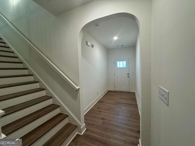 7695 Baron Rd, Fairburn, GA 30213 - foyer featuring stairs, wood finished floors, baseboards, and arched walkways