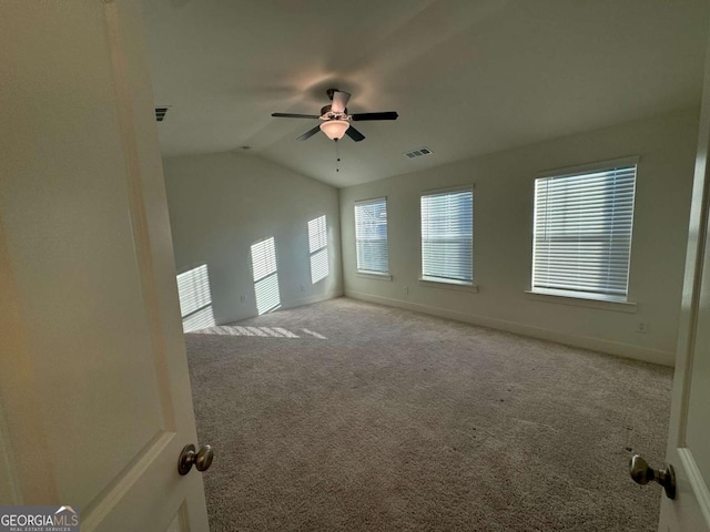 7695 Baron Rd, Fairburn, GA 30213 - carpeted spare room with ceiling fan, lofted ceiling, and baseboards