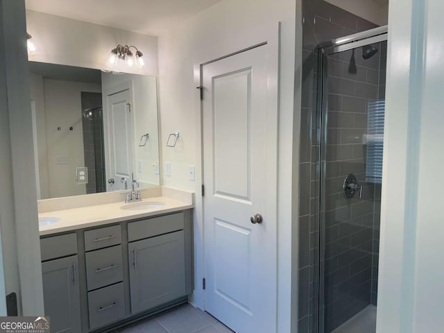 7695 Baron Rd, Fairburn, GA 30213 - full bath featuring double vanity, a shower stall, and tile patterned floors