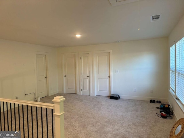 7695 Baron Rd, Fairburn, GA 30213 - carpeted empty room with baseboards and attic access