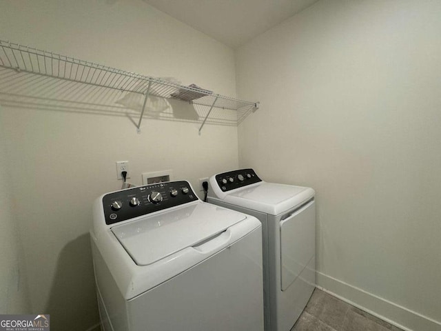 7695 Baron Rd, Fairburn, GA 30213 - laundry room featuring separate washer and dryer and baseboards