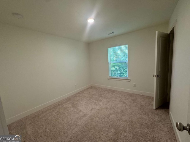 7695 Baron Rd, Fairburn, GA 30213 - empty room featuring light colored carpet and baseboards