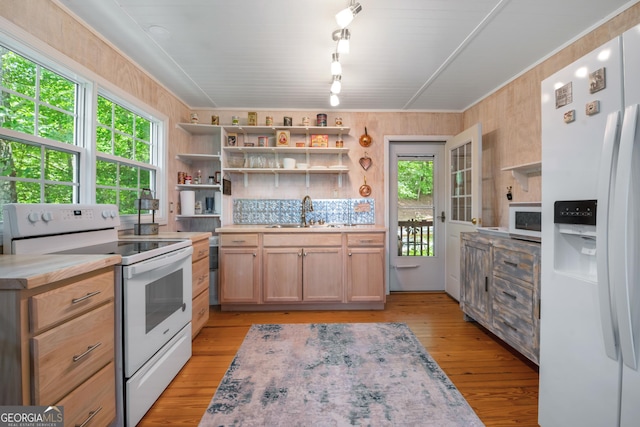 254 Rue Ln, Clayton, GA 30525 - kitchen with white appliances, open shelves, a sink, light countertops, and wooden walls