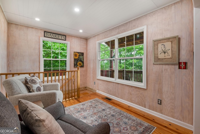 254 Rue Ln, Clayton, GA 30525 - living room featuring hardwood / wood-style floors, baseboards, wooden walls, and recessed lighting