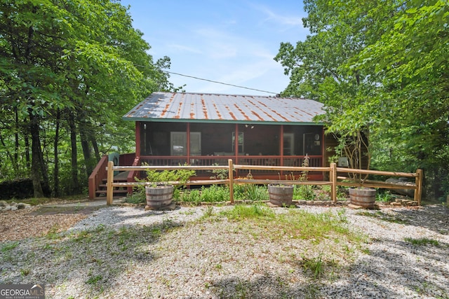 254 Rue Ln, Clayton, GA 30525 - back of house with a sunroom and metal roof
