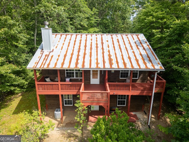 254 Rue Ln, Clayton, GA 30525 - rear view of house with a wooden deck, a chimney, and a patio