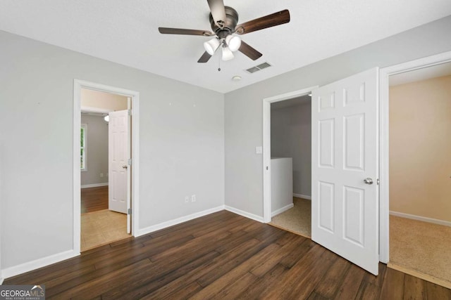 174 Randall Dr, Rockmart, GA 30153 - unfurnished bedroom featuring wood finished floors, baseboards, and ceiling fan