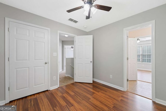 174 Randall Dr, Rockmart, GA 30153 - unfurnished bedroom featuring dark wood-style flooring, baseboards, and a ceiling fan