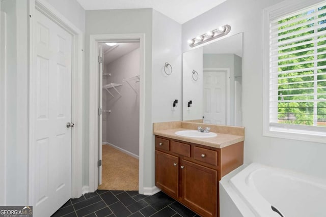 174 Randall Dr, Rockmart, GA 30153 - full bath featuring vanity, tile patterned floors, a bath, and a spacious closet