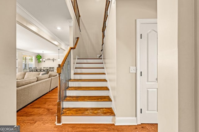 86 Crestview Dr, Guyton, GA 31312 - stairs featuring wood finished floors, crown molding, baseboards, and recessed lighting