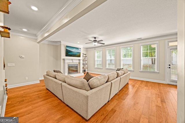 86 Crestview Dr, Guyton, GA 31312 - living area with a glass covered fireplace, baseboards, recessed lighting, light wood-style floors, and ornamental molding