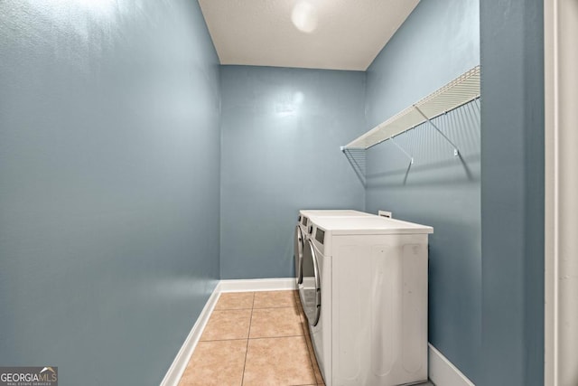 86 Crestview Dr, Guyton, GA 31312 - laundry room featuring washing machine and dryer, baseboards, and light tile patterned floors