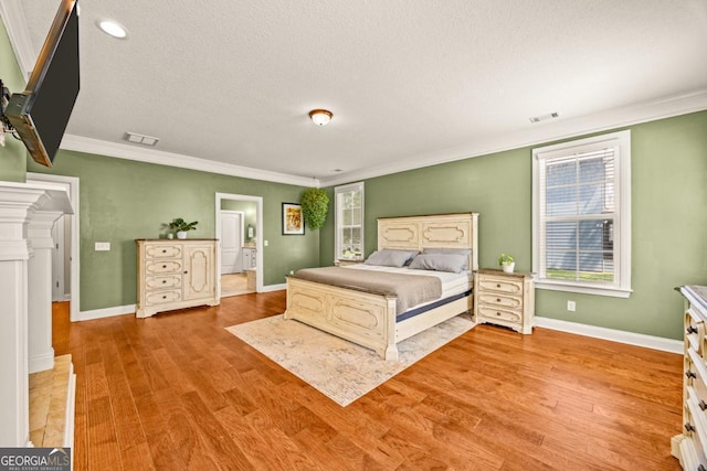 86 Crestview Dr, Guyton, GA 31312 - bedroom featuring ornamental molding, light wood-style floors, baseboards, and a textured ceiling