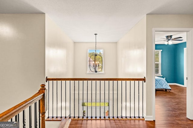 86 Crestview Dr, Guyton, GA 31312 - corridor with wood finished floors, healthy amount of natural light, baseboards, and an upstairs landing
