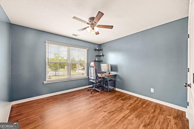 86 Crestview Dr, Guyton, GA 31312 - home office with a ceiling fan, wood finished floors, baseboards, and a textured ceiling