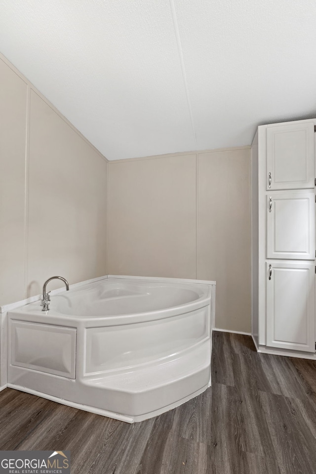 368 Hemlock Ln, Locust Grove, GA 30248 - full bath featuring wood finished floors and a bath