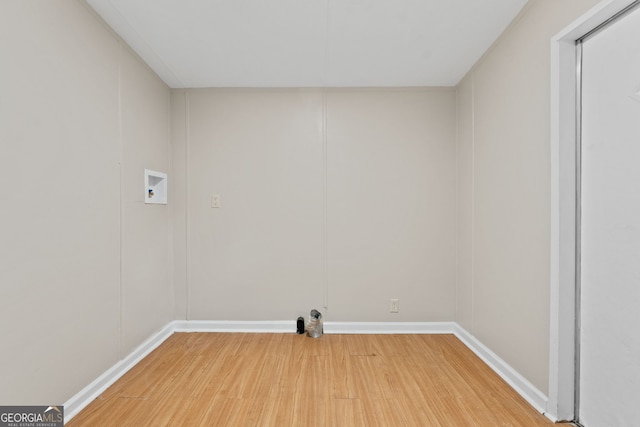 368 Hemlock Ln, Locust Grove, GA 30248 - washroom featuring light wood-type flooring, hookup for a washing machine, and baseboards