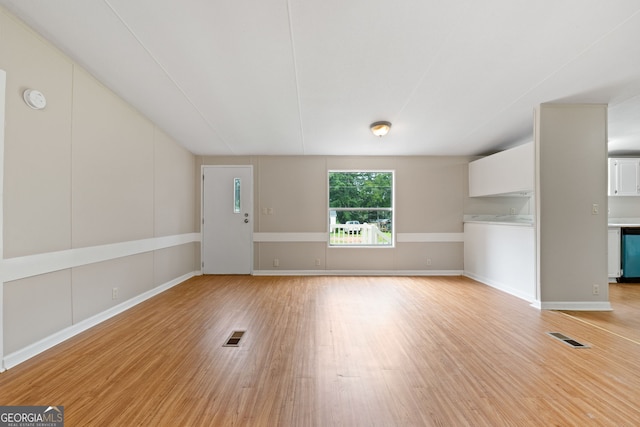 368 Hemlock Ln, Locust Grove, GA 30248 - unfurnished living room with light wood-style flooring and baseboards