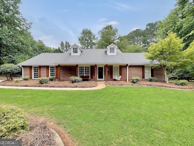 602 Pine Knoll Ct, Mcdonough, GA 30252 - cape cod-style house featuring brick siding, a front lawn, roof with shingles, and a porch