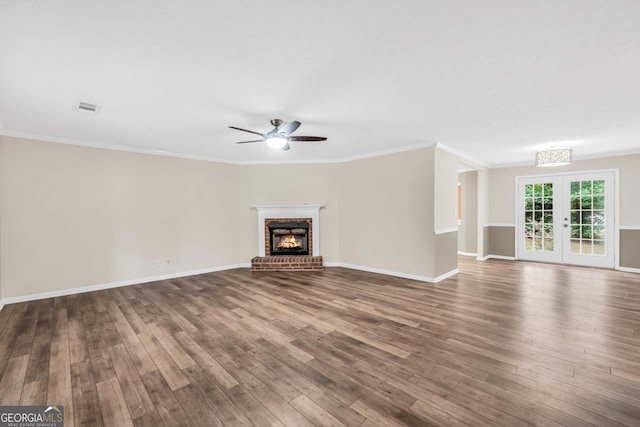 602 Pine Knoll Ct, Mcdonough, GA 30252 - unfurnished living room featuring ceiling fan, wood finished floors, a brick fireplace, ornamental molding, and baseboards