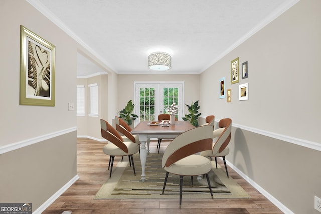 602 Pine Knoll Ct, Mcdonough, GA 30252 - dining space with wood finished floors, baseboards, and crown molding