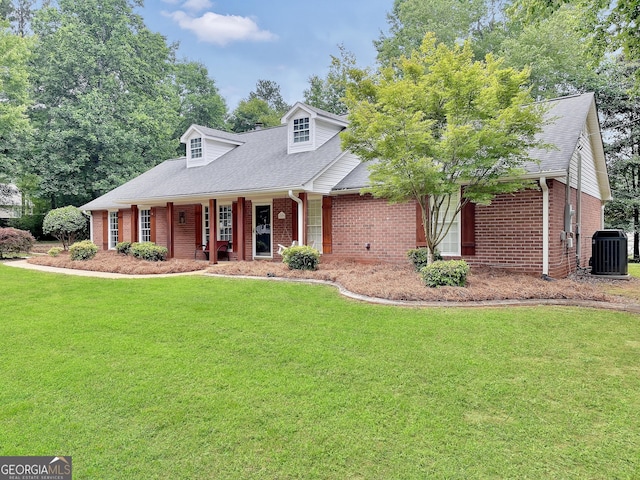 602 Pine Knoll Ct, Mcdonough, GA 30252 - cape cod house with a front yard, brick siding, central air condition unit, and covered porch