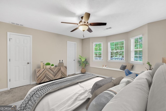 602 Pine Knoll Ct, Mcdonough, GA 30252 - carpeted bedroom with multiple windows, baseboards, and ceiling fan