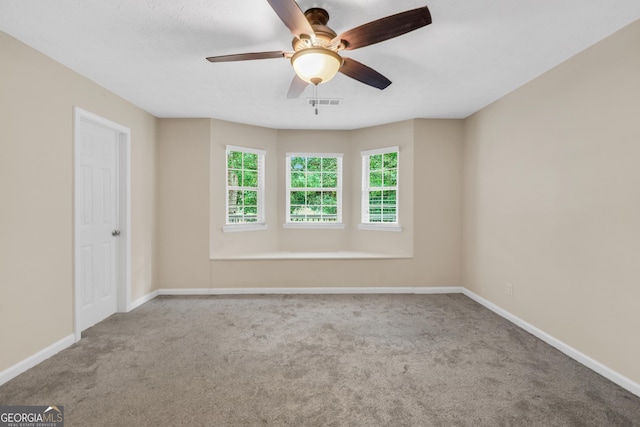602 Pine Knoll Ct, Mcdonough, GA 30252 - spare room with a ceiling fan, carpet floors, and baseboards