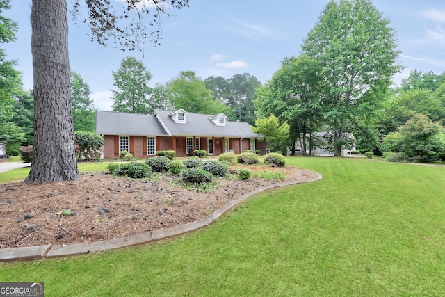 602 Pine Knoll Ct, Mcdonough, GA 30252 - cape cod home with a front lawn, brick siding, a porch, and view of scattered trees