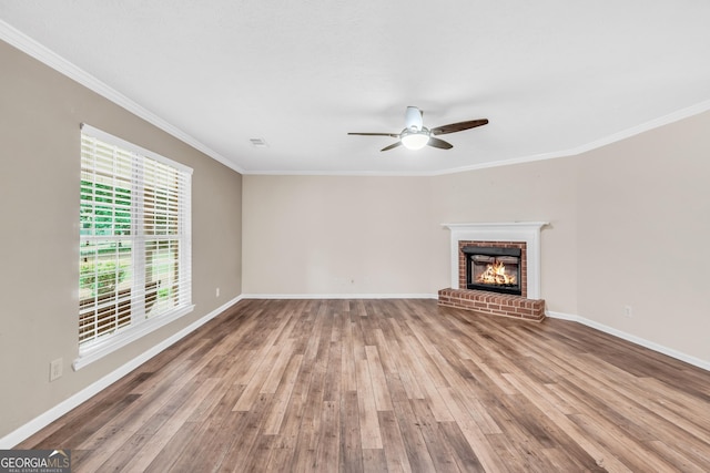 602 Pine Knoll Ct, Mcdonough, GA 30252 - unfurnished living room featuring wood finished floors, ceiling fan, ornamental molding, a fireplace, and baseboards