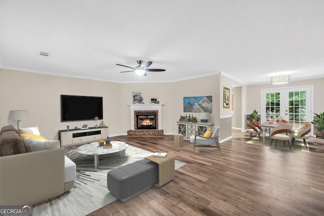 602 Pine Knoll Ct, Mcdonough, GA 30252 - living area featuring ceiling fan, wood finished floors, a fireplace, french doors, and baseboards