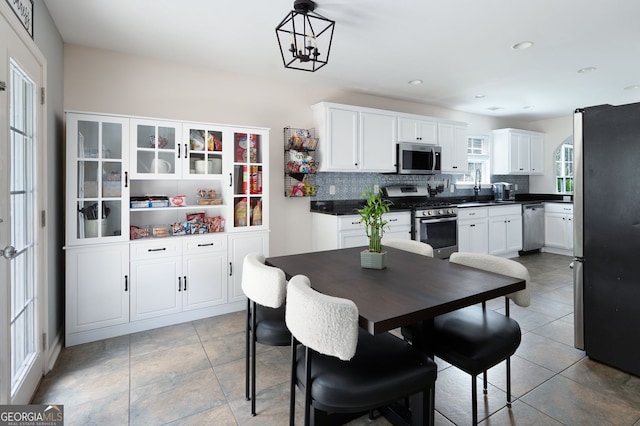 784 Crestworth Xing, Powder Springs, GA 30127 - dining space with a chandelier and recessed lighting