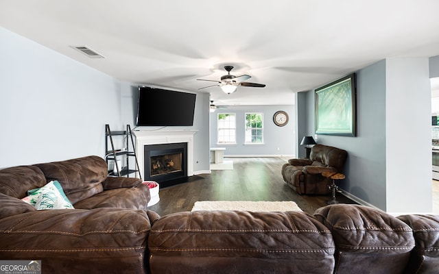 784 Crestworth Xing, Powder Springs, GA 30127 - living area with ceiling fan, dark wood-type flooring, and a fireplace with flush hearth