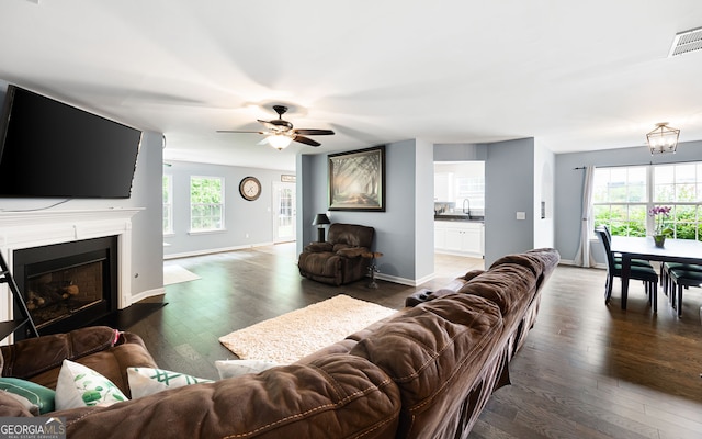 784 Crestworth Xing, Powder Springs, GA 30127 - living area featuring hardwood / wood-style floors, a ceiling fan, and a fireplace