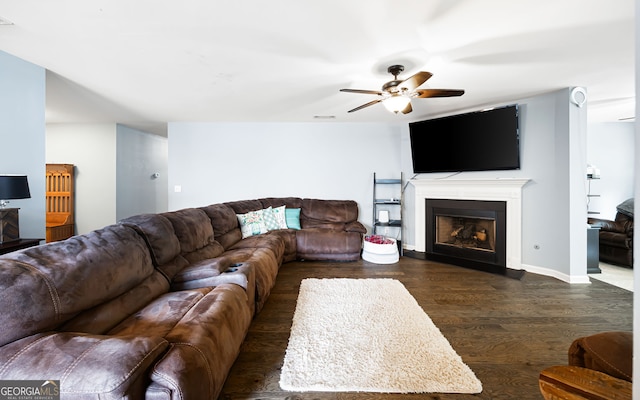 784 Crestworth Xing, Powder Springs, GA 30127 - living room with ceiling fan, a fireplace, and dark wood-type flooring