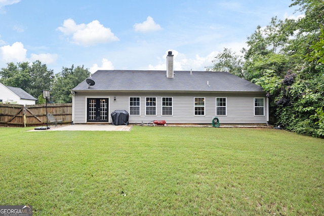 784 Crestworth Xing, Powder Springs, GA 30127 - back of property with a patio area, french doors, and a chimney